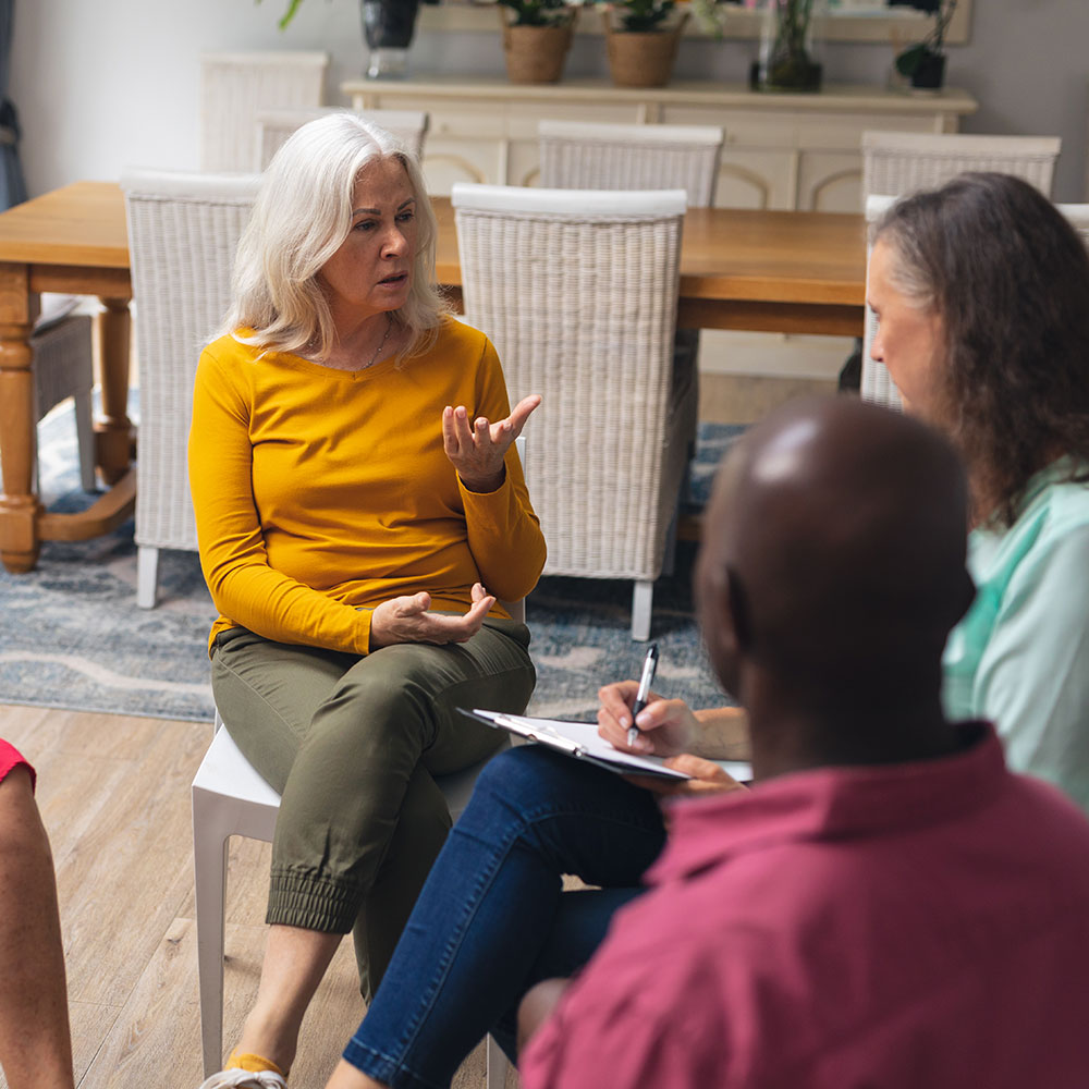 caucasian-senior-woman-talking-with-multiracial-pe-2025-04-03-05-35-28-utc